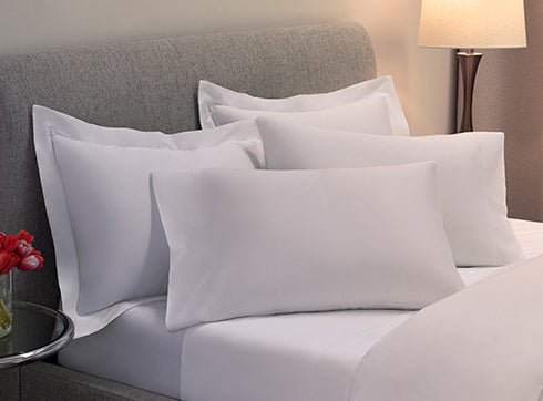 Sateen sheet set and duvet cover set on bed