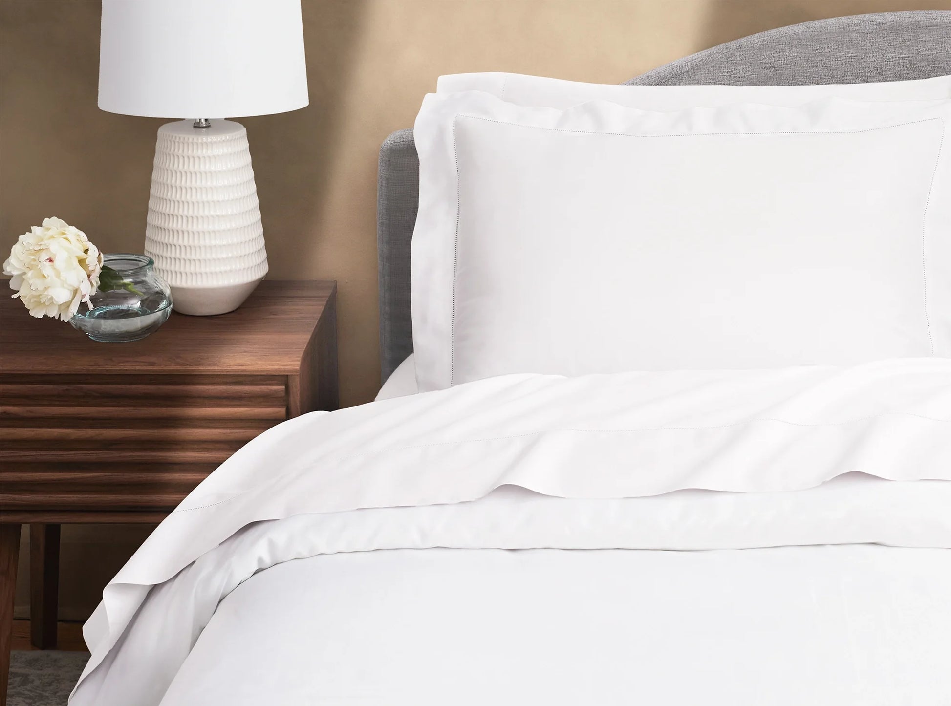 Buttery soft texture of organic sateen sheet set - single-ply cotton weave.